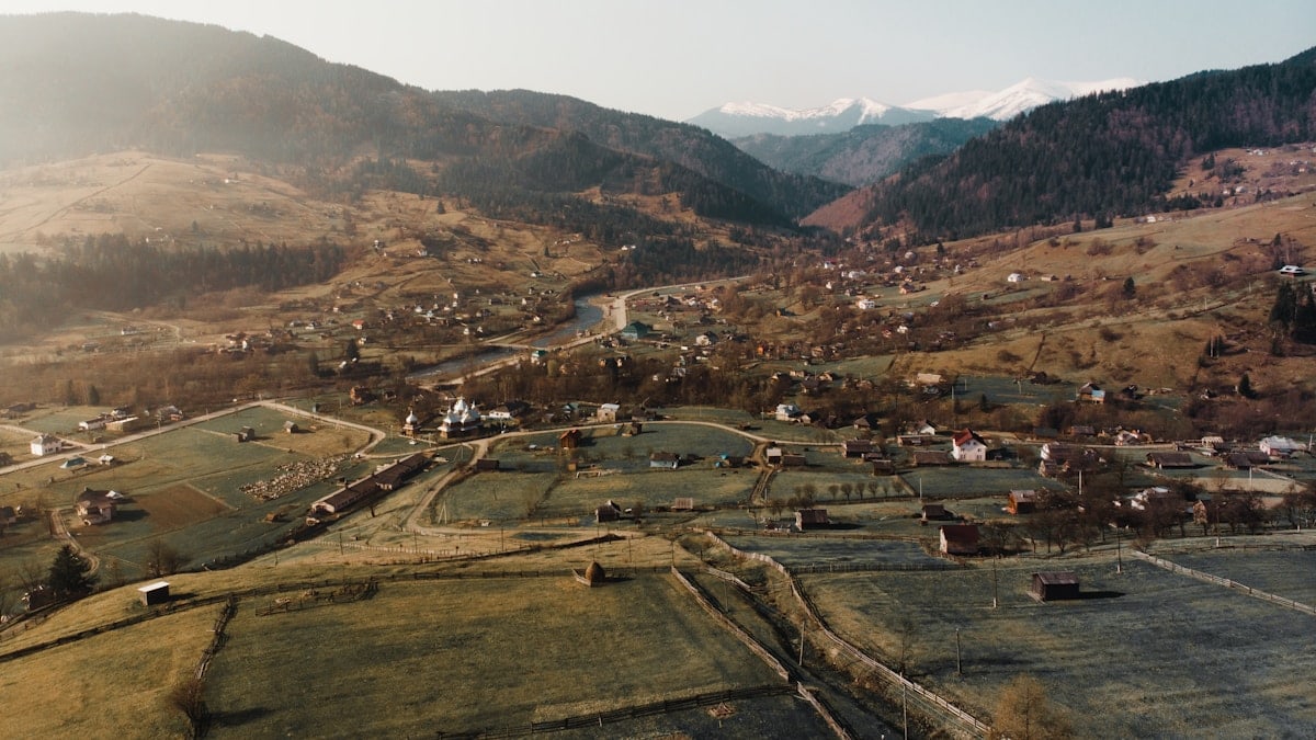 aerial view of city near mountains during daytime